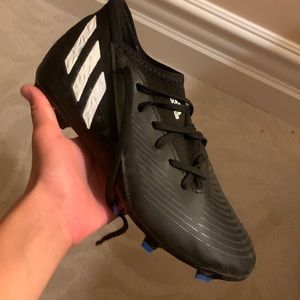 These are the adidas predators that are black blue and white size 4 and wore1tim
